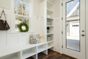 A bright, organized and welcoming entryway, foyer, or mudroom.