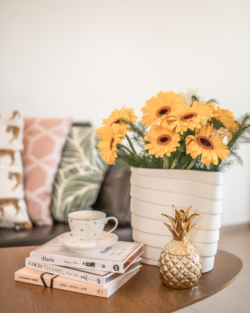 living room table with books and flowers